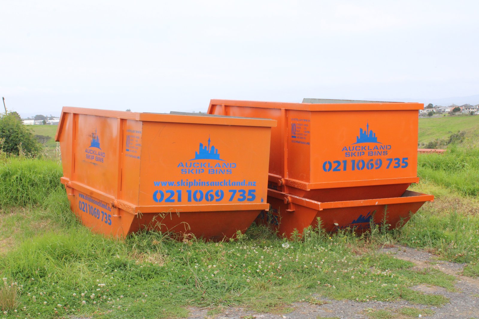Auckland Skip Bins — orange skip bins on site